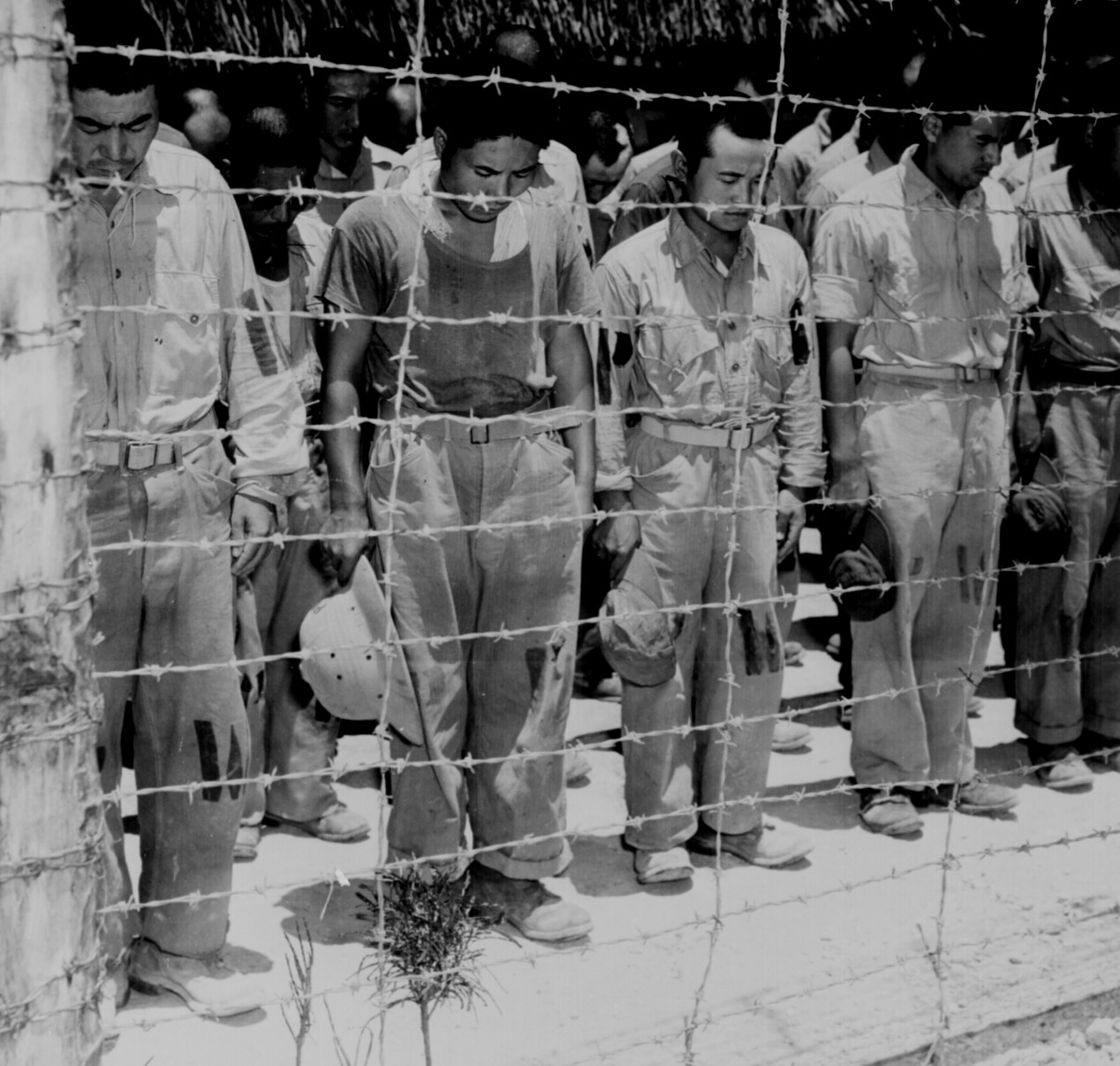 20 - Japan prisoners listening to Japan surrender.jpg